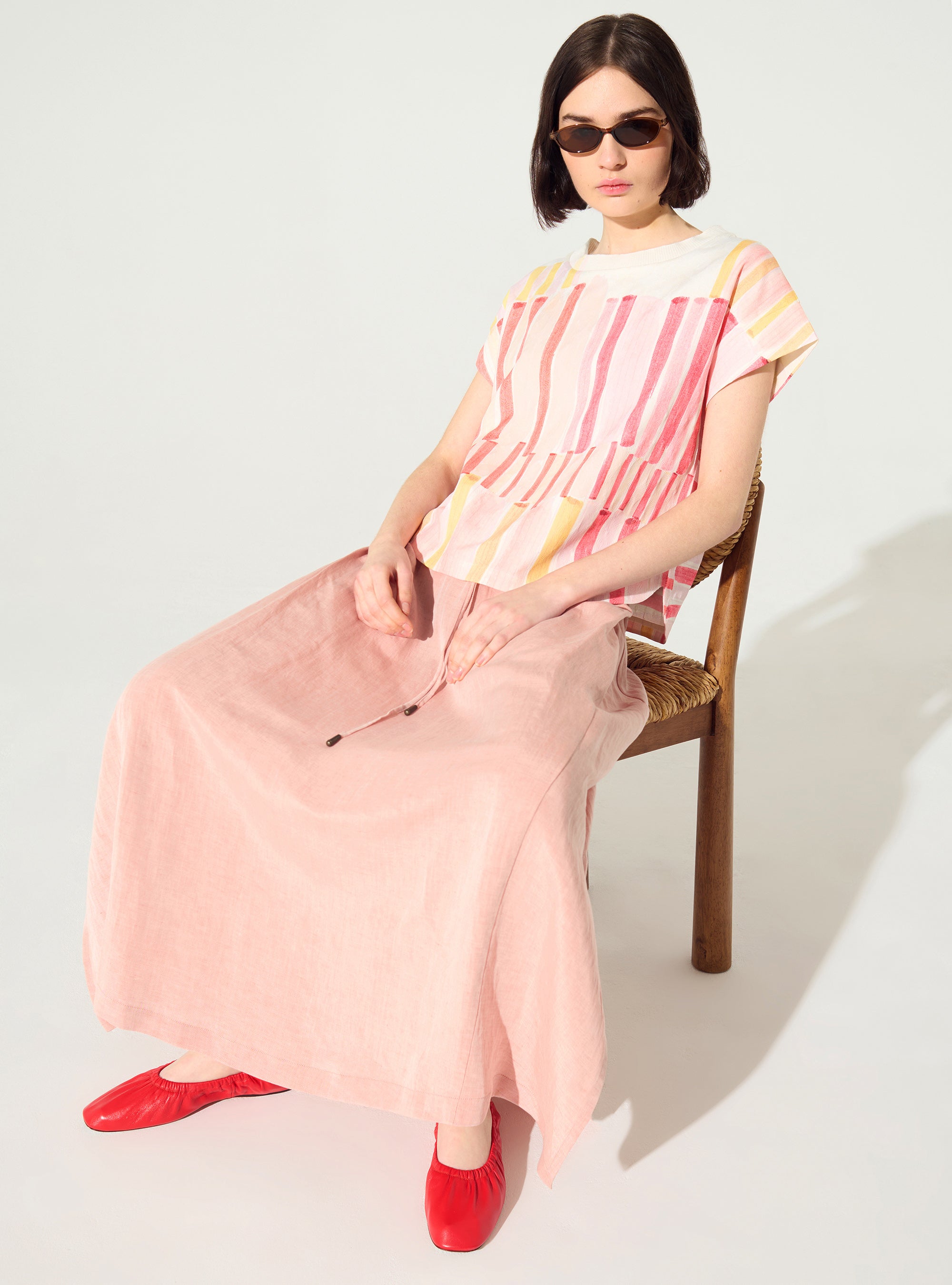 Pleated and embellished red blouse