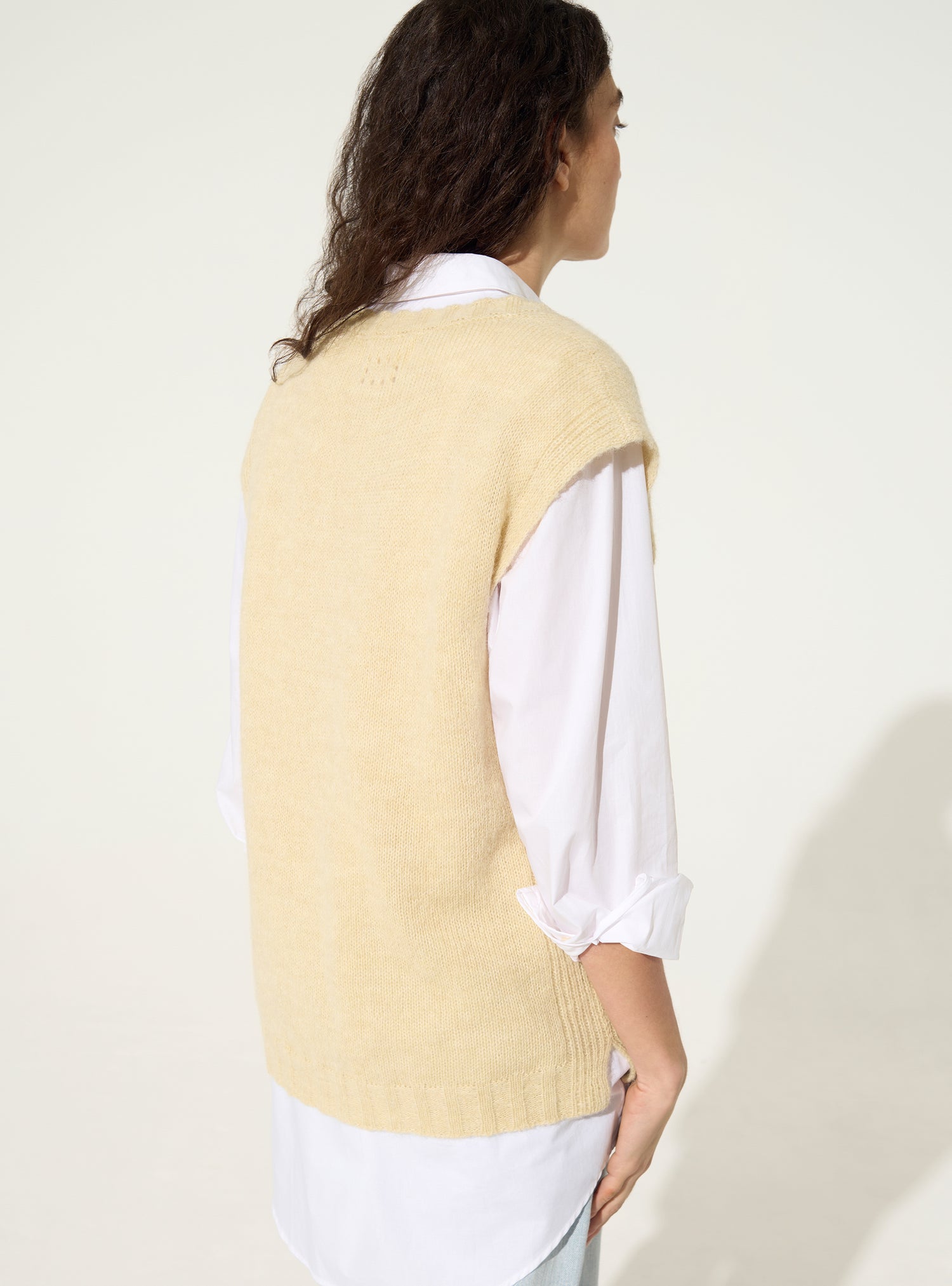 White sleeveless sweater