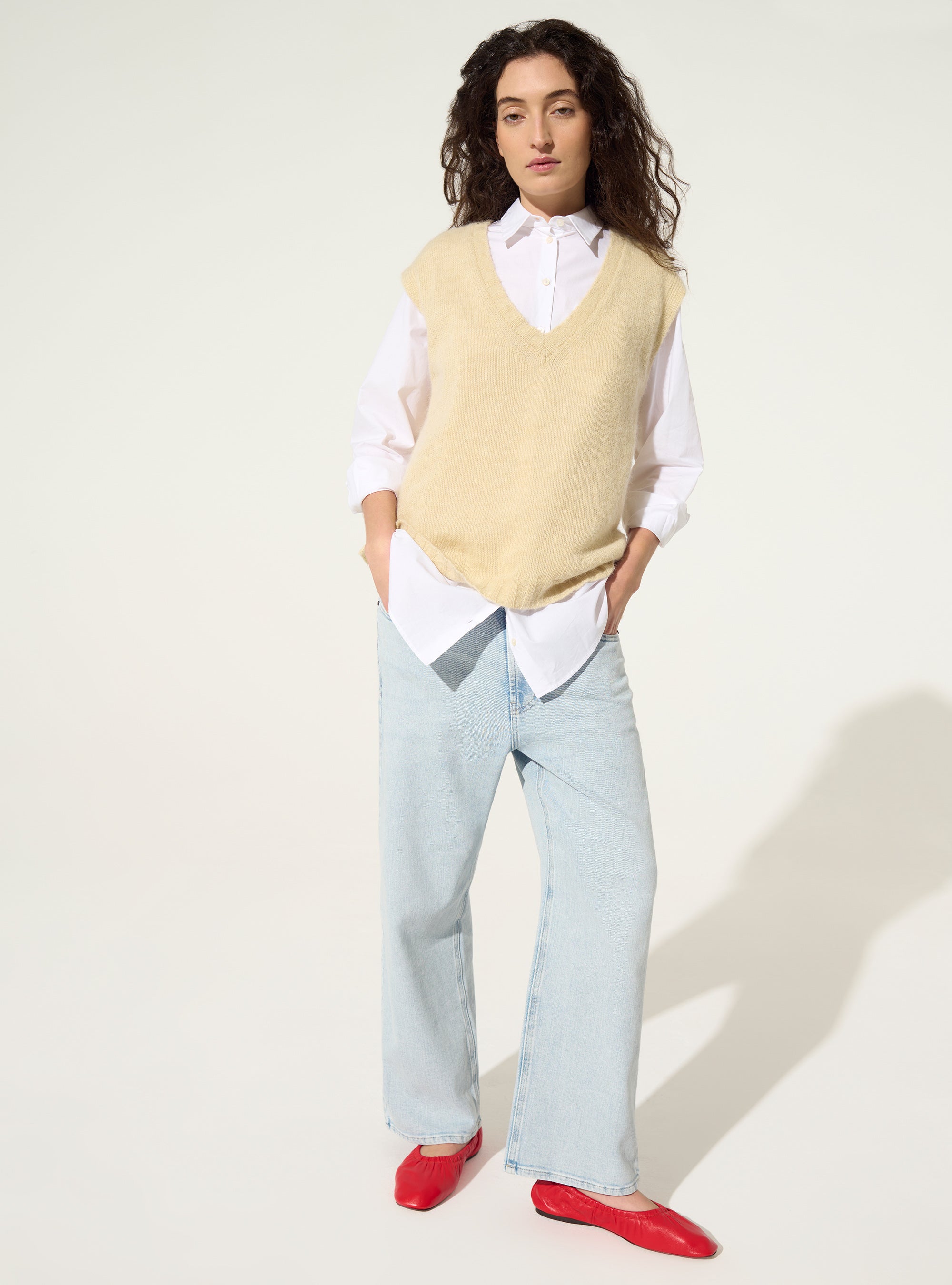 White sleeveless sweater