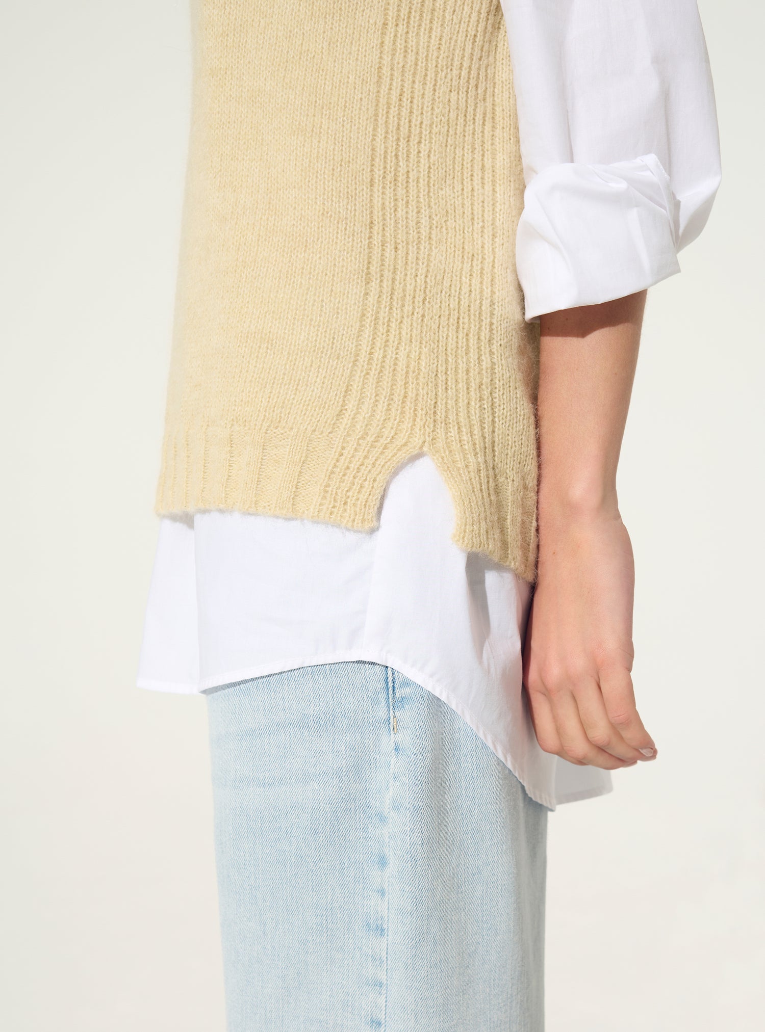 White sleeveless sweater