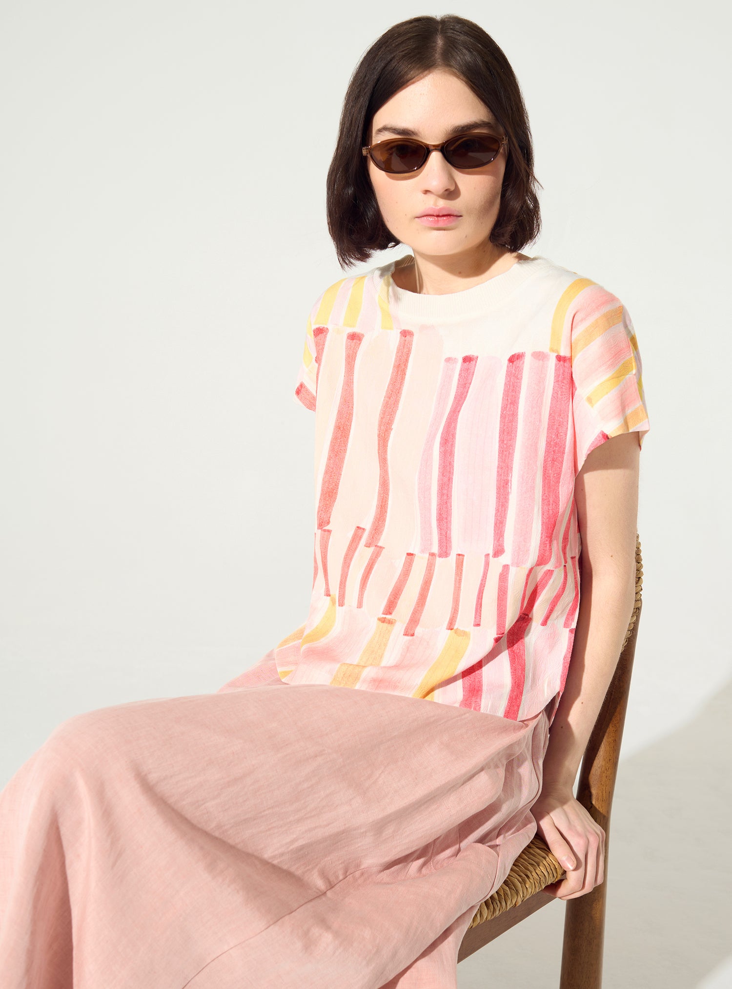 Pleated and embellished red blouse