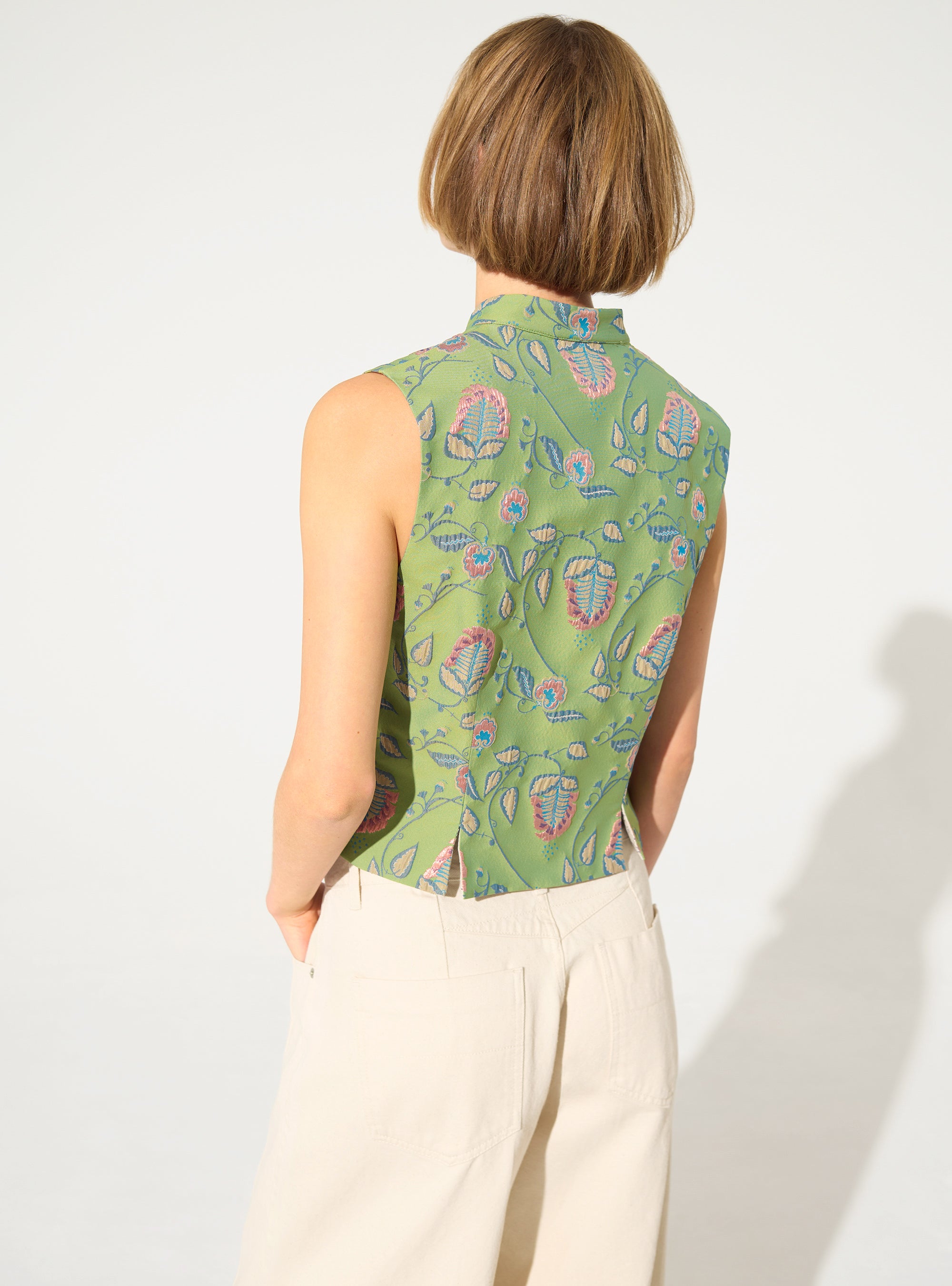 Fitted vest with green print